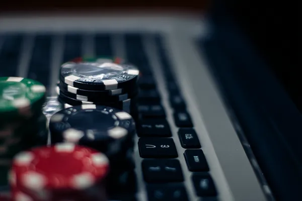 67777 Jackpot Slots — Spin for massive rewards A dramatic shot of winning sevens landing on a slot reel surrounded by shining gold coins, symbolizing big wins.